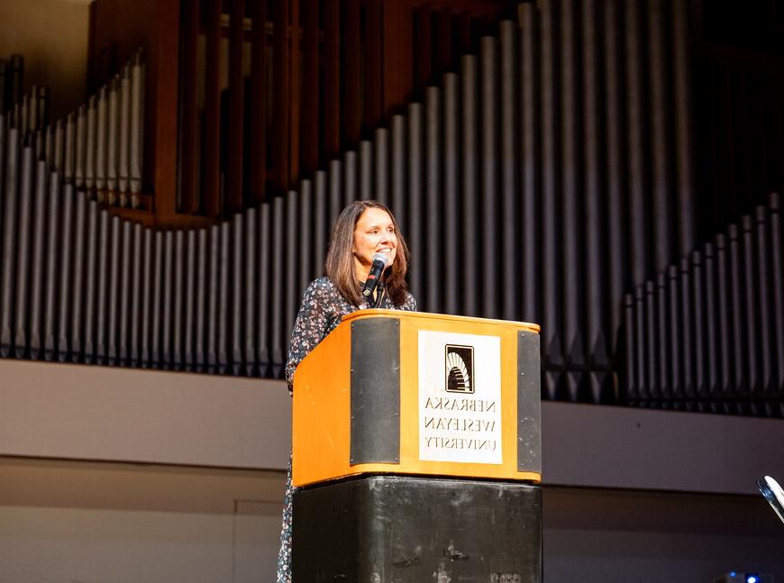 Carol Spahn, director of the US Peace Corps, gives remarks at podium.